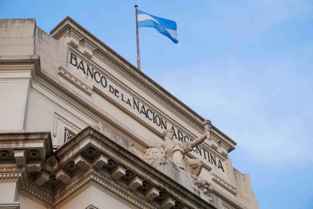 pexels-photo-13606490-13606490 Low angle view of Banco de la Nación Argentina with flag in Concordia, Entre Rios.