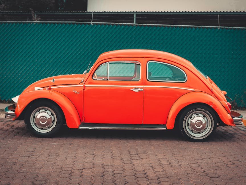 pexels-photo-28279599-28279599 Side view of a classic orange Volkswagen Beetle parked in an urban area in Puebla, Mexico.
